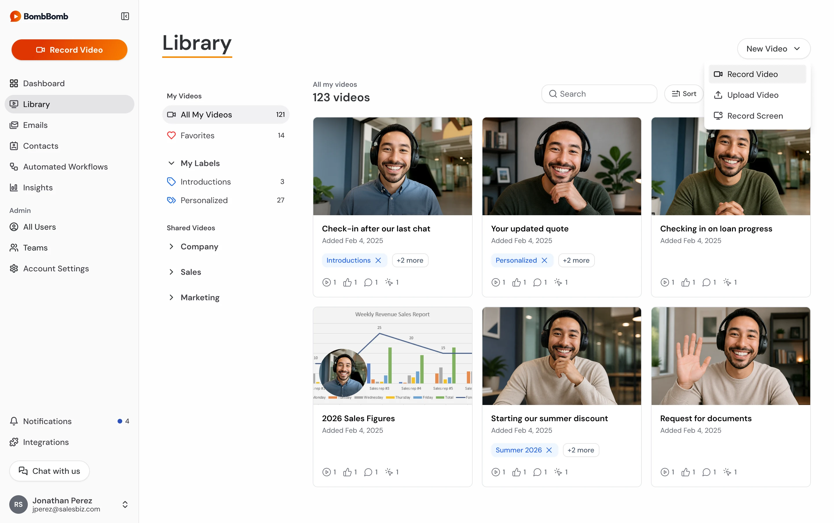 Video library showing a grid of video cards with labels and engagement counts, and a New Video menu open